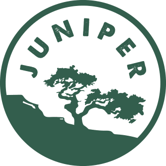 The Juniper Room boutique vacation rental logo Comal Inn