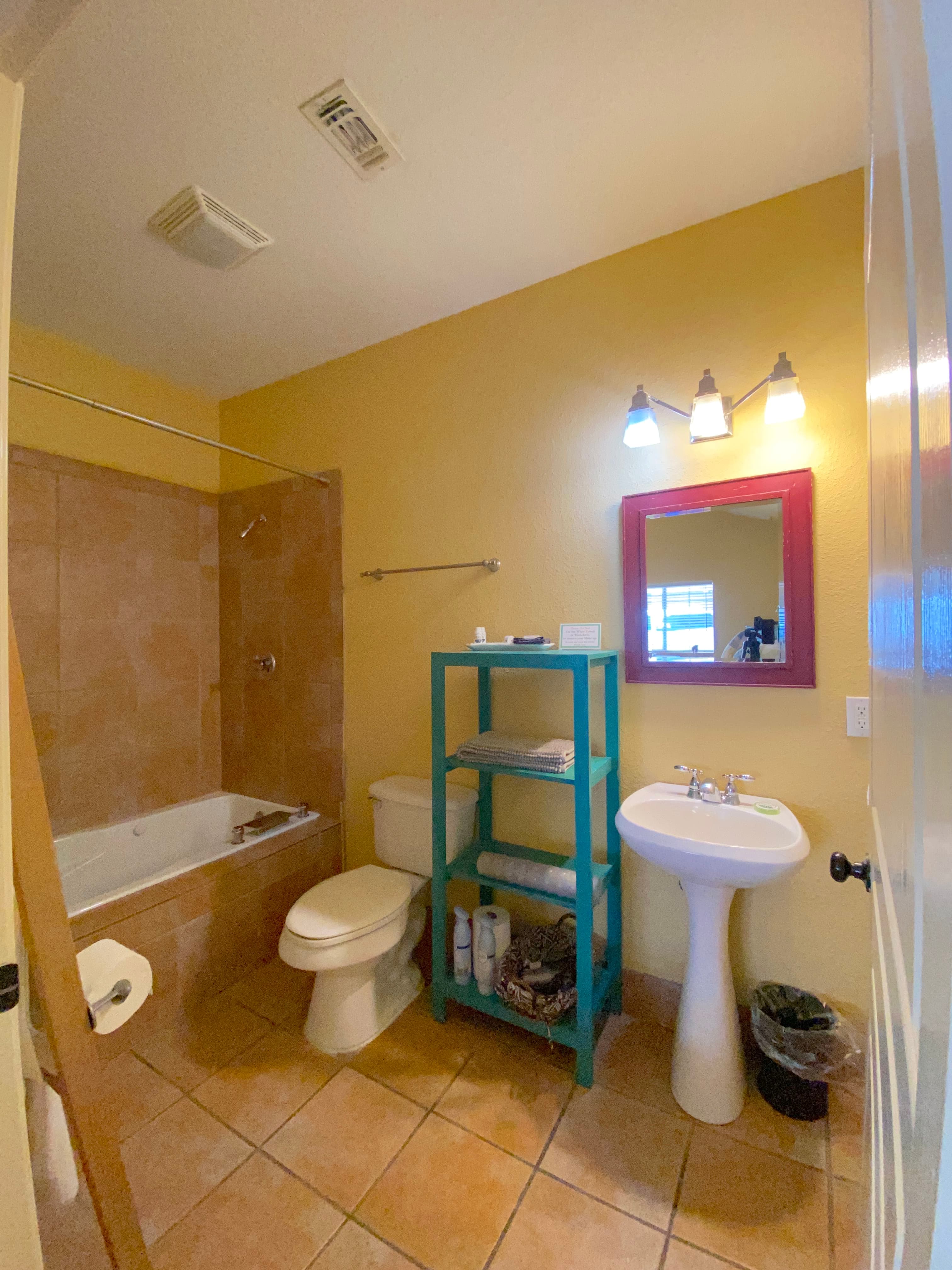 Mountain Laurel Room — Bright Studio with Wrap-Around Patio & Jetted Tub interior view 3 at Comal Inn boutique vacation rental New Braunfels TX