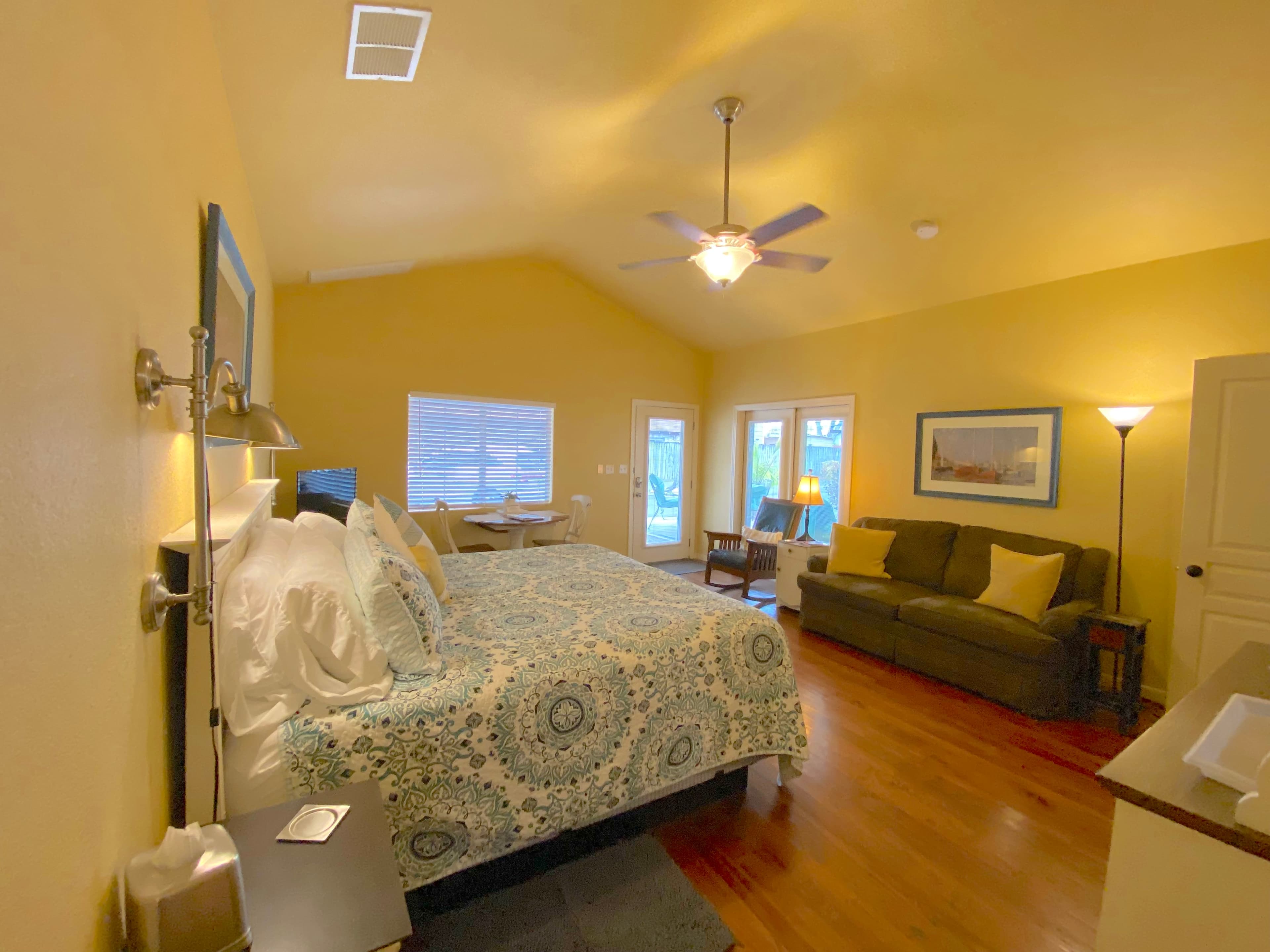 Mountain Laurel Room — Bright Studio with Wrap-Around Patio & Jetted Tub interior view 2 at Comal Inn boutique vacation rental New Braunfels TX