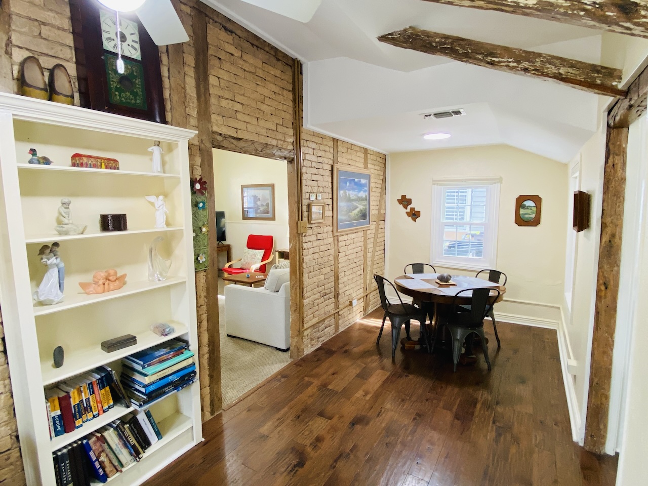 Dining room view from the historic fachwerk room showing exposed timber beams and built-in bookshelves