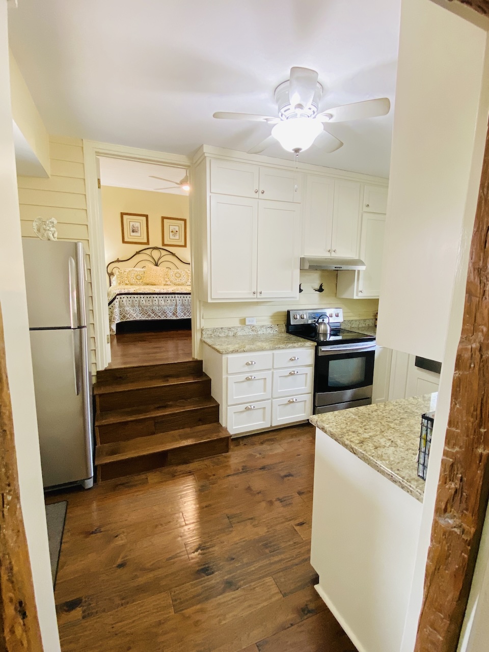View from the historic fachwerk study and dining area into the kitchen of the New Braunfels Cottage